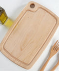 Premium Acrylic Two In One Cutting Board Router Template For Woodworking And Inlay Projects Laser Cut Quarter Inch Thick Guide, viewed from above with olive oil and utensils.