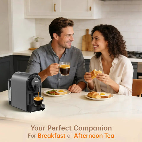 Top Tier Espresso Maker For Nes Pods With 20 Bar Italian Pump And One Touch Brewing 1400 Watt Automatic Coffee Brewer In Sleek Gray on kitchen counter with couple.
