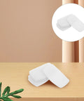 10Pk Self Adhesive Sneaker Heel Repair Patches Snug Fit Breathable Mesh Liner on wood table with plant.
