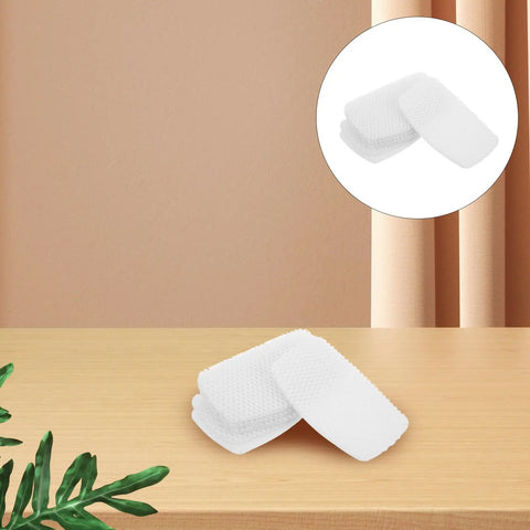 White Self Adhesive Sneaker Repair Patches For Fresh Kicks Instant Heel Hole Fix set on wooden surface with green leaves.
