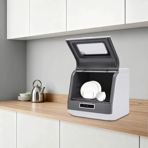 Hassle-Free Countertop Dishwasher With A Slick Stainless Steel Interior on a kitchen counter, holding clean plates.