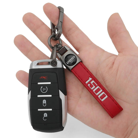 Red Leather Key Chain For Ram 1500 With 360 Degree Rotating Ring And Anti Lost D Ring held in hand, showing durable car key fob holder