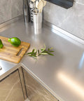 Stainless Steel Look Self Adhesive Contact Paper Peel And Stick Vinyl Wrap on kitchen countertop, showing metallic finish