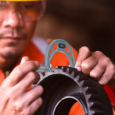 Technician using Outside Micrometer Set 0 To 4 Inches Pro Grade Machinist Tool Kit With Carbide Tipped Measuring Heads on gear.