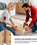 Couple installing Heavy Duty Bed Rail Fasteners Five Inch Mortise Bracket Set Of Four Wood Bed Frames using tools.