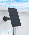 Premium 5 Watt Solar Panel Set To Keep Outdoor Cameras Never Running Dry Featuring Hefty IP65 Rain Proof Housing and extended wiring mounted on a wall.