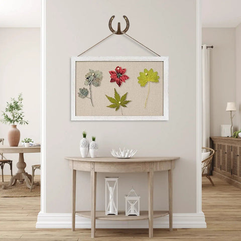 Heavy Duty Cast Iron Horseshoe Wall Hooks Wild West Coat And Hat Rack Slick Rustic Home Decor hanging above framed pressed leaves.