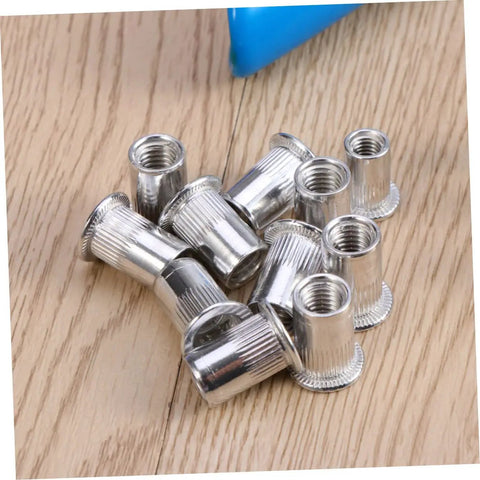 Top Notch 86 Piece Heavy Duty Rivet Nut Kit With M5 M7 M8 Threaded Inserts Perfect For Steel Metal Work, Duct Repair, And Awesome DIY Projects Comes In Sturdy Storage Case For Pros and Amateurs silver M8 rivet nuts on wood surface