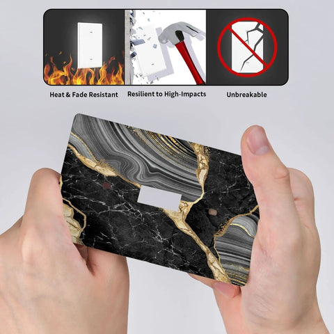 Sleek Black Gold Marble Single Toggle Light Switch Plate Cover in hand, showing heavy duty ABS material, 4.5 by 2.76 inches.
