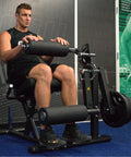 Man using Plate Loaded Leg Extension And Curl Machine For Home Gym Seated Leg Curl And Quad Extension With 180 Lb Plate Load