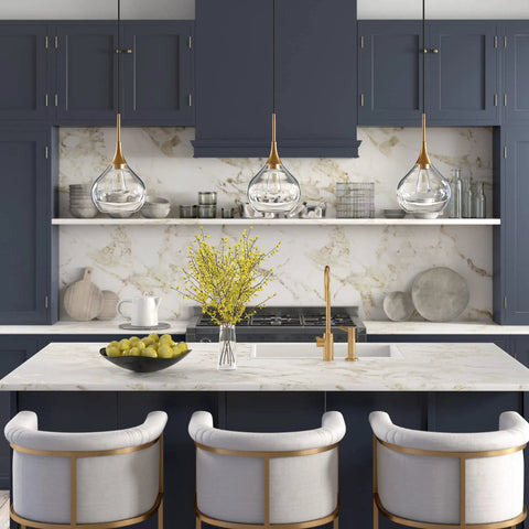 9 Inch Wide Pendant Light With Glass Shade In Brass And Clear Finish above kitchen island with marble countertop