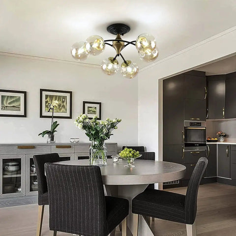Bold Black Chandelier Lighting With Glass Orbs in modern dining room, featuring stylish black bean chandeliers, contemporary metal frame
