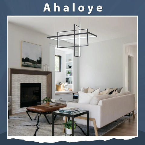 Modern Black 3 Light LED Chandelier With Remote Control Dimmable Color Changing Pendant Lighting For Dining Room Living Room And Kitchen Island Rectangle Frame Fixture in a modern living room with a white sofa and fireplace.