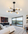 Six Light Sputnik Chandelier Pendant Light With 4.7 Inch Glass Globe Shades in modern bedroom with floor-to-ceiling window