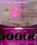 Pink LED Hand Neon Sign For Wall Decor USB Powered Nail Room And Girls Room Neon Light For Bedroom Home Bar Salon Party Gift For Women Lit And Trendy Neon Wall Art mounted above a desk with adjustable brightness settings.
