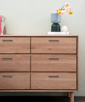 Dresser with 10 Pack Matte Black Cabinet Handles 4 Inch Center To Center, 6-3/8 Inch Overall Length, installed on drawers.