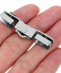 Top Notch Eight Piece Glass Door Roller Kit Featuring Heavy Duty Steel H Type Roller Wheels With Silent Double Bearing Mechanism shown in hand.