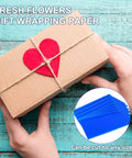Hands holding gift box with red heart, Transparent Candy Color Flower Wrapping Paper Pack 20 Sheets For Bouquets And Gift Wrap shown