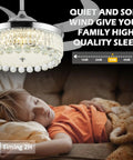 Child sleeping under 42 Inch Reversible Crystal Ceiling Fan With Lights And Remote Control, chandelier style, quiet operation.