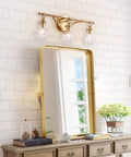 Brushed Gold Vanity Light Fixture With Three Clear Glass Globes Over Mirror, Damp Rated Bathroom Bar Light, 20 Inch Long
