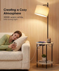 Space Saving Floor Lamp With Built In Round Table And USB Type C And USB A Charging Ports 9W LED Bulb Nightstand For Bedroom And Living Room White Ideal For Cozy Corners And Small Spaces next to a sofa