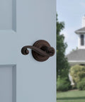 Lido Entry Door Handle With Lock And Key Reversible Exterior Lever in Venetian Bronze on front door with SmartKey Security