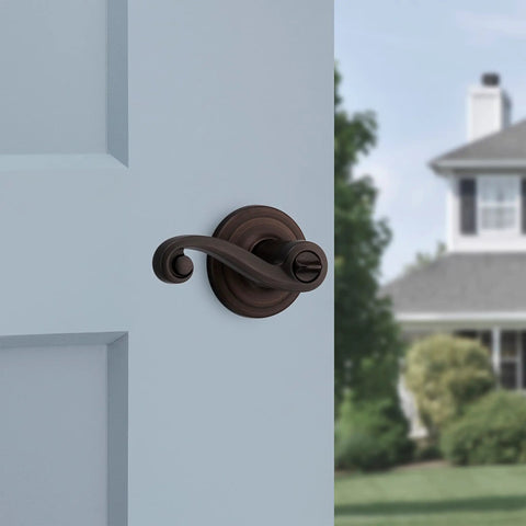 Lido Entry Door Handle With Lock And Key Reversible Exterior Lever in Venetian Bronze on front door with SmartKey Security