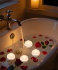 7 Piece Battery Operated Flameless LED Candles With Remote Timer, Waterproof Indoor Outdoor in bath with rose petals