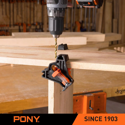 Four Pack Right Angle Woodworking Clamps With Adjustable Jaw For 90 Degree Corners Keep Boards Flat And Aligned Holds Three Sixteenths To Seven Eighths Inch Boards For Cabinet Frames And T Joints In Light Duty Projects used on wooden boards with a drill showing example use in a workshop.