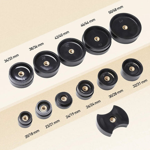 Assorted sizes of round black press tools from the All In One Watch Repair Tool Kit With Press Tool And Link Removal Set
