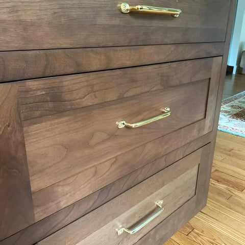 Unlacquered Solid Brass Cabinet Pull And Knob Set on wooden dresser, handmade hardware 7 inch length, serene modern style.
