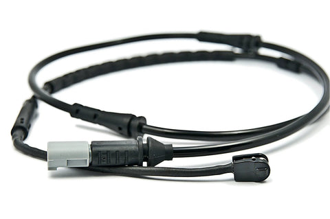 BMW front brake pad wear sensor cable with gray connector and black sensor housing, close-up view