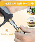 Close-up of a stainless steel pressure washer quick-connect coupler being attached to a spray gun handle.