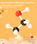 Portable Organic Chemistry Model Kit With 124 Pieces for Classrooms and Hands On Home Labs, ball-and-stick model on open book