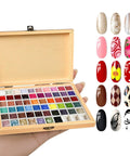 Hand holding Mini Patting Gel Nail Kit With 57 Colors Ombre Gradient Gel Polish Palette showing nail design samples