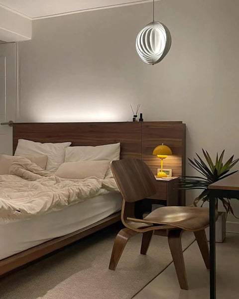 Dope 360 Degree Adjustable Moon Pendant Light With Rotating Sphere Shade in a modern bedroom with wooden furniture