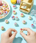 Hands crafting with Imitation Food Resin Beads Set 30 Pcs 3D Fruit Cupcake Mini Dessert Spacers for jewelry and decor projects