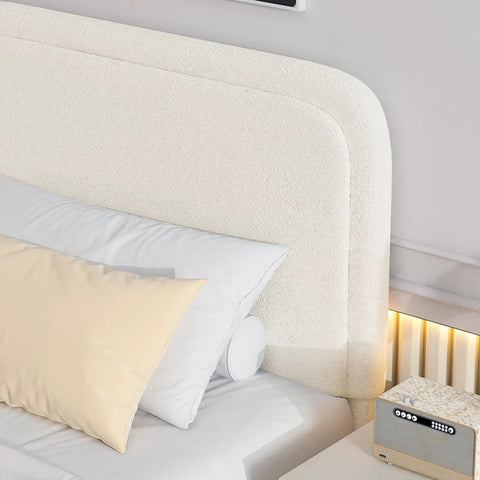Snug Twin Bed Frame With Ultra Soft Cloud Boucle Fabric And Cream Upholstered Headboard featuring smooth rounded corners and pillows.