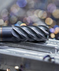 Close-up of 4 Pack HSS-AL End Mills 1.5mm Cutting Diameter 6mm Shank 4 Flutes Upcut Spiral Milling Cutter on metal surface