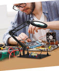 Person using Six Piece Flexible Soldering Alligator Clamps With Third Hand Tool And Magnifying Lamp For PCB Work And Electronics Repair