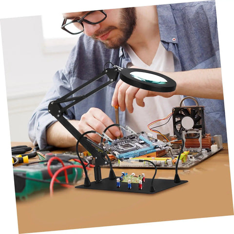 Person using Six Piece Flexible Soldering Alligator Clamps With Third Hand Tool And Magnifying Lamp For PCB Work And Electronics Repair