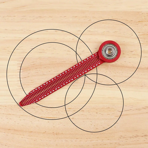 Heavy Duty Aluminum Circle Maker Compass For Woodworking And Carpentry measuring circles on a wooden surface with steel ball bearing.