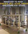 Industrial kitchen equipment on green caster wheels with message about chemical resistance