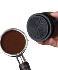 Top Shelf Wood Tamper For Espresso Makers Featuring Spring Loaded Calibration For 51mm 54mm And 58mm Portafilters with espresso grounds.