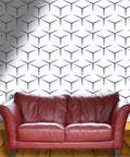 Solid Choice Thick Textured Vinyl Wallpaper Roll No Sweat Peel And Stick Wall Covering Durable Self Adhesive Home Decor Sheet with geometric design behind a red leather couch.