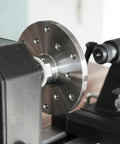 Close-up of Heavy Duty 1x8Tpi Face Plate Kit For Woodturning Lathes, showcasing the metal disc mounted on a lathe.