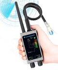 Hand holding Hidden Camera Detector And Bug Finder For Privacy Protection Portable 4 In 1 RF Signal Scanner.