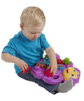 Child playing with Totally Awesome Dope Monkey Gears Stacking And Spinning Toy with colorful cogs on a sturdy base.
