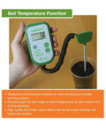 Hand holding Digital Soil Tester For PH, Temperature, And Fertility, Three Way Analyzer with corded probe in soil sample