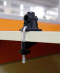 Universal Desk Clamp Mount Bracket for Mic Stands and Table Lamps attached to a desk edge, ideal for DIY setups.